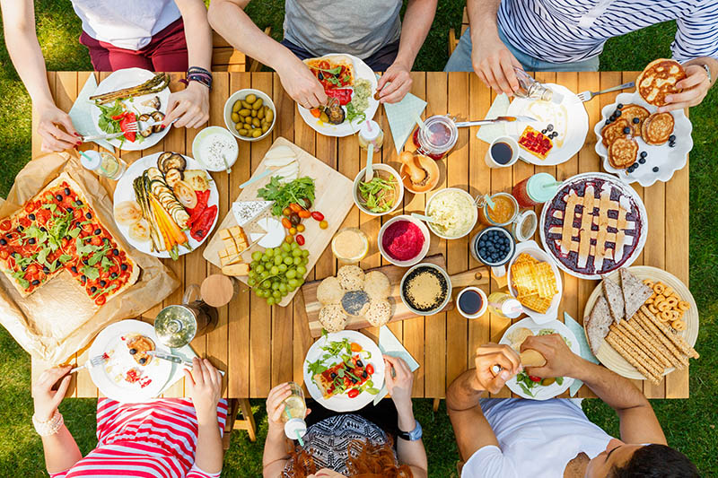 Multicultural friends meal in the garden 30